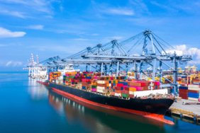 Container cargo ship at industrial port in import export busines