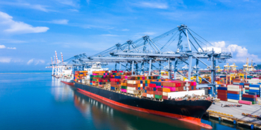 Container cargo ship at industrial port in import export busines